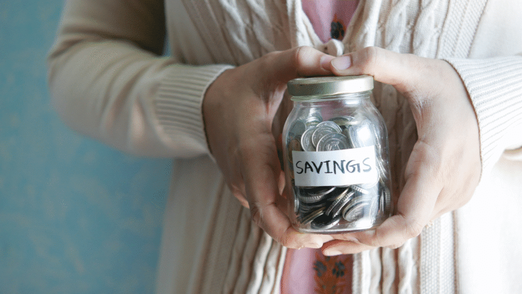 Savings jar holding various coins