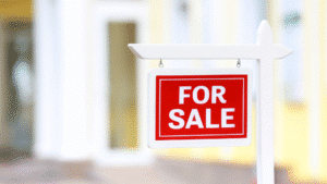 For Sale sign outside a modern property